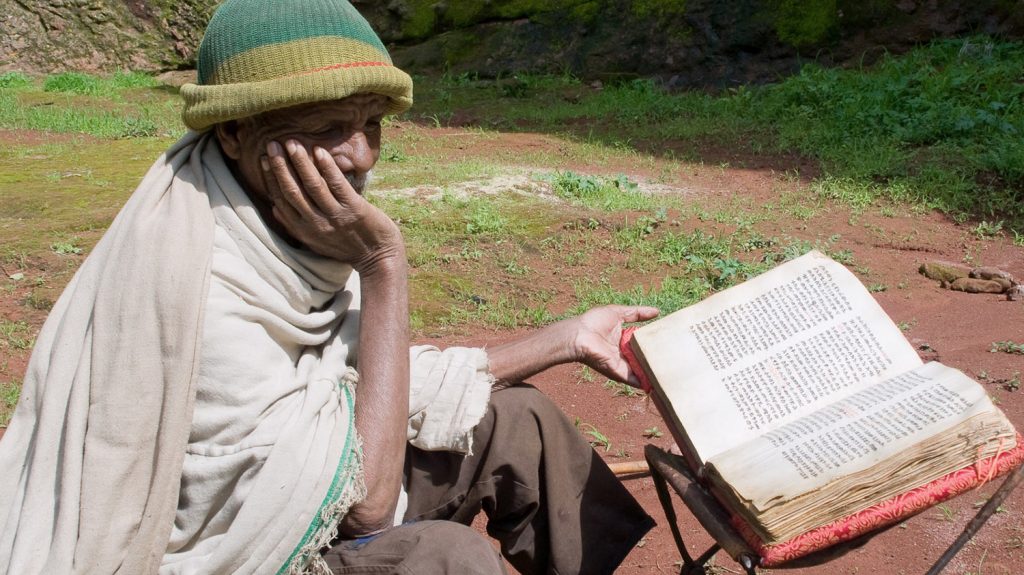 Ethiopian man reading the Bible