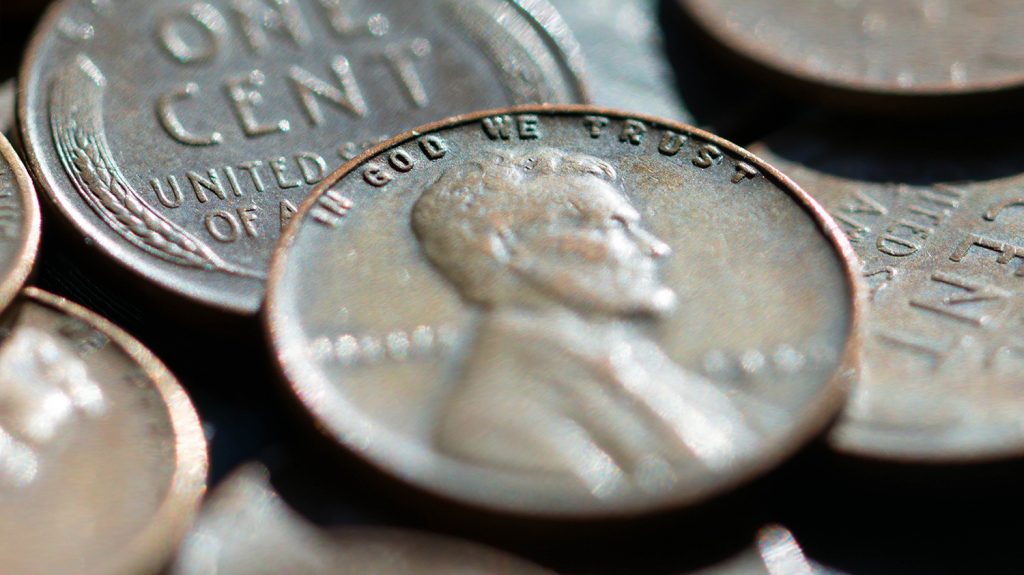 US coins showing the motto In God We Trust