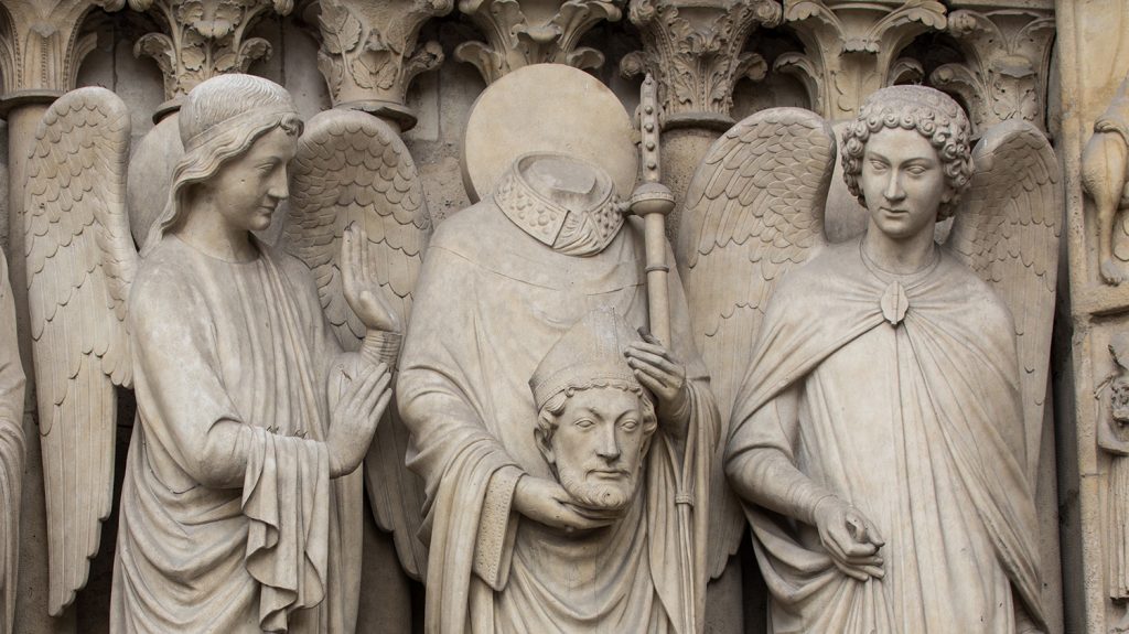 St Denis with angels on the facade of Notre Dame, Paris